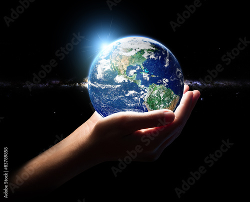 hand hold earth and in universe environment concept element fini