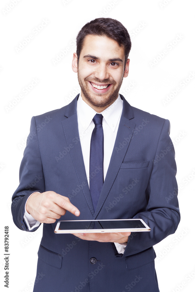 Smiling business man pointing to a tablet computer, isolated on Smiling business man pointing to a tablet computer, isolated on