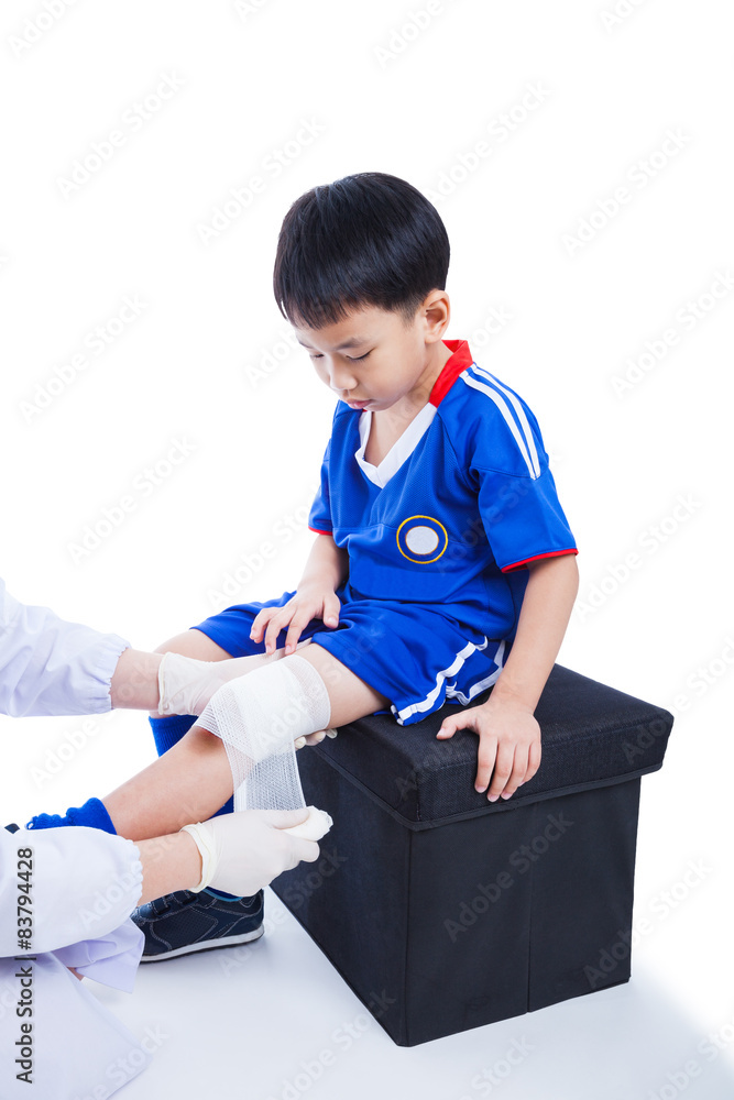 Youth asian soccer player in blue uniform. Knee joint pain. Youth asian soccer player in blue uniform. Knee joint pain.