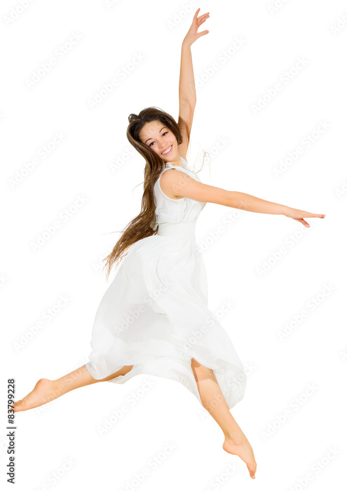 Young dancing girl in white dress
