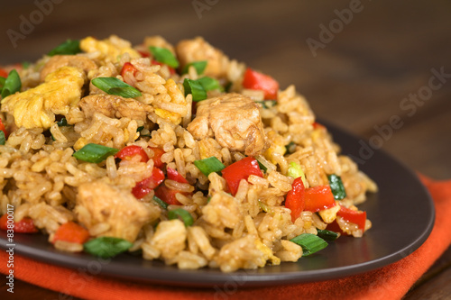 Chinese fried rice with vegetables, chicken and fried eggs