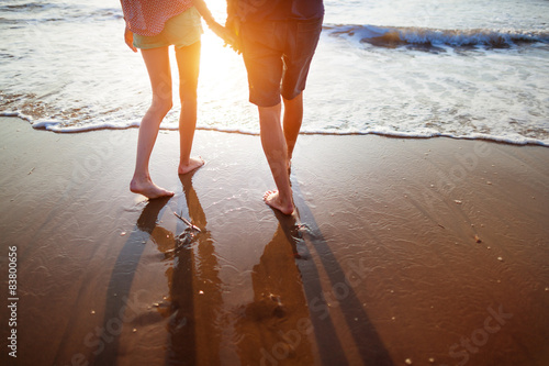 Young couple walking on the beach