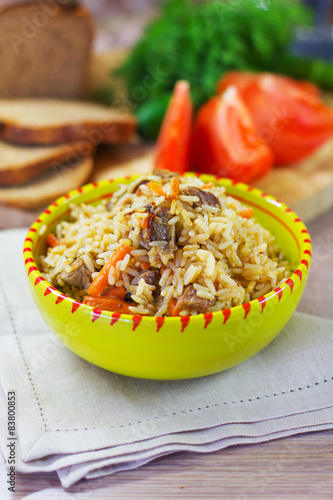 pilaf with lamb in a green piala