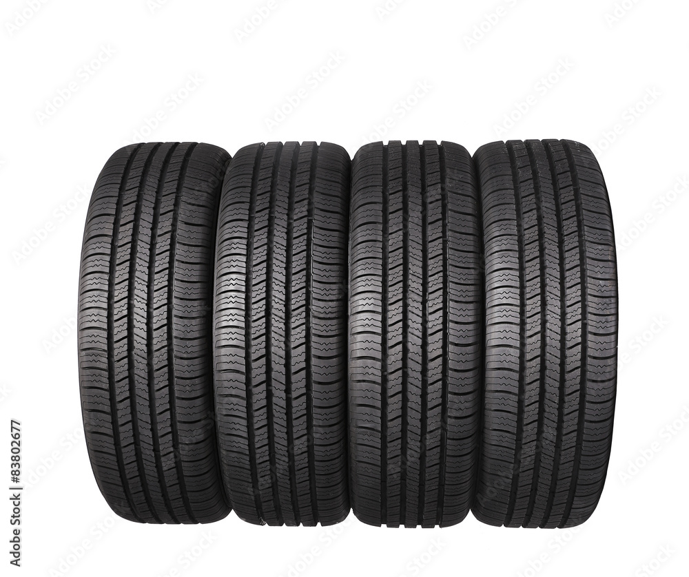 four automobile black rubber tires isolated on white background four automobile black rubber tires isolated on white background