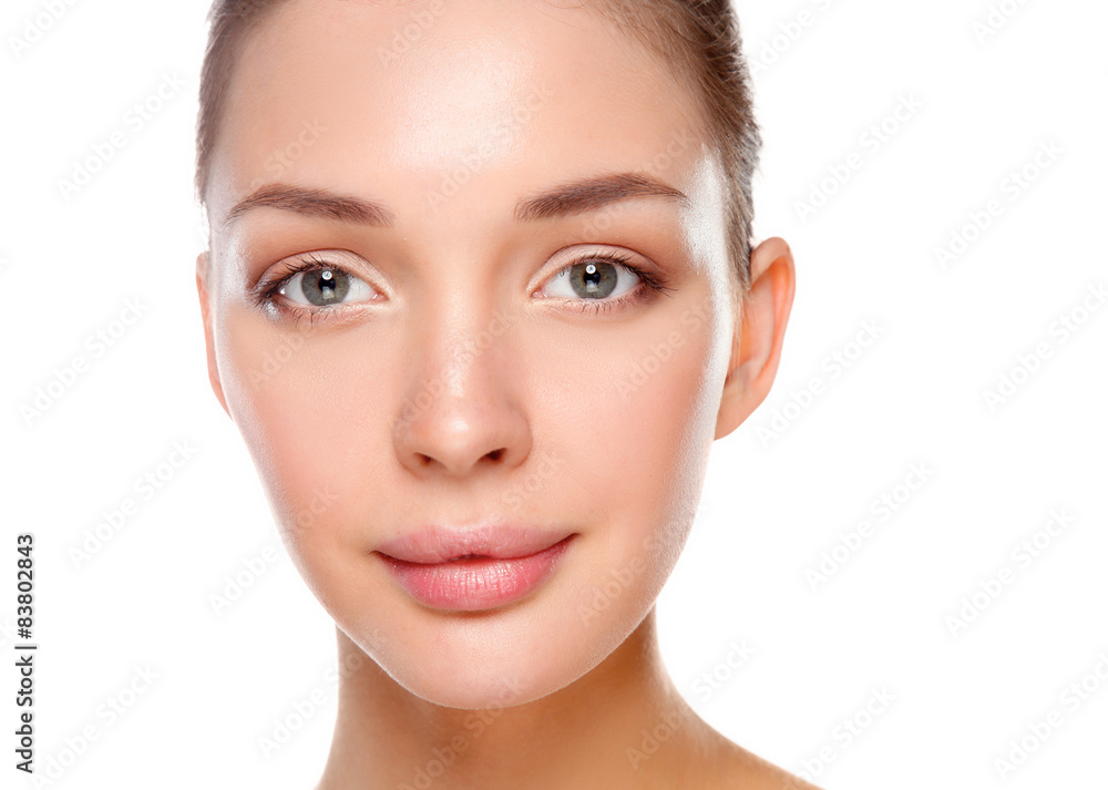 Fototapeta premium Close up portrait of beautiful young woman face. Isolated on