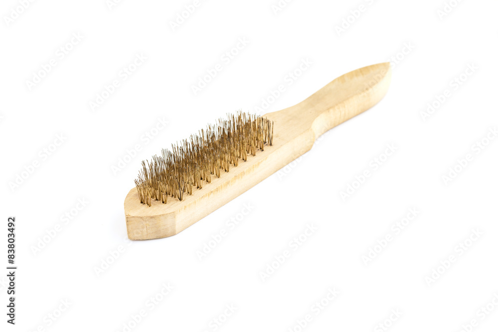 Close-up Brass brush with wooden handle isolated on white Close-up Brass brush with wooden handle isolated on white