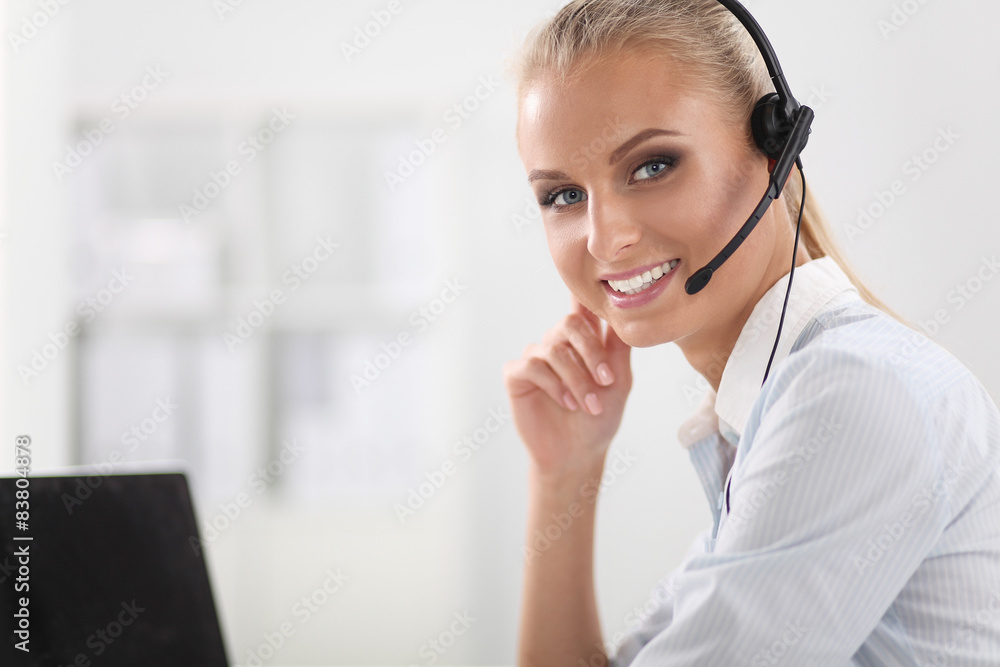 Close-up portrait of a customer service agent sitting at office Close-up portrait of a customer service agent sitting at office