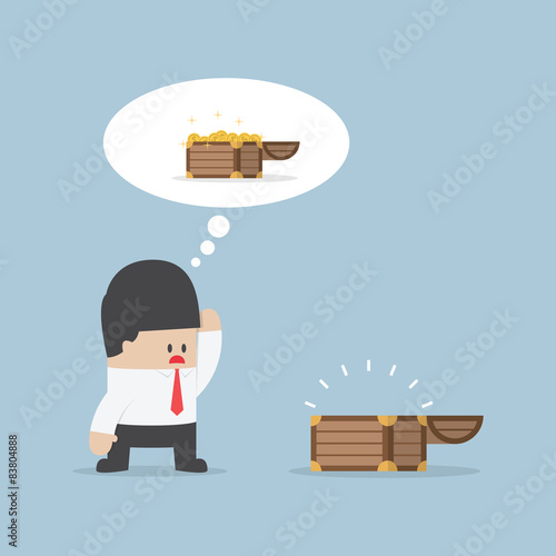 Businessman and empty treasure box