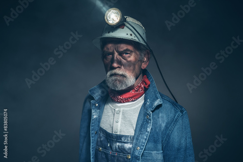 Humorless Bearded Old Miner Staring at the Camera photo