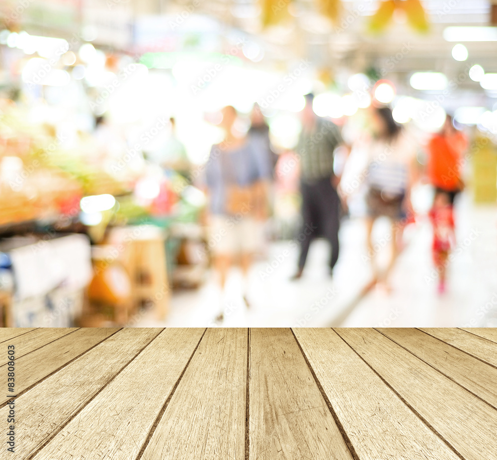 Perspective wood blur market and people with bokeh light Perspective wood blur market and people with bokeh light