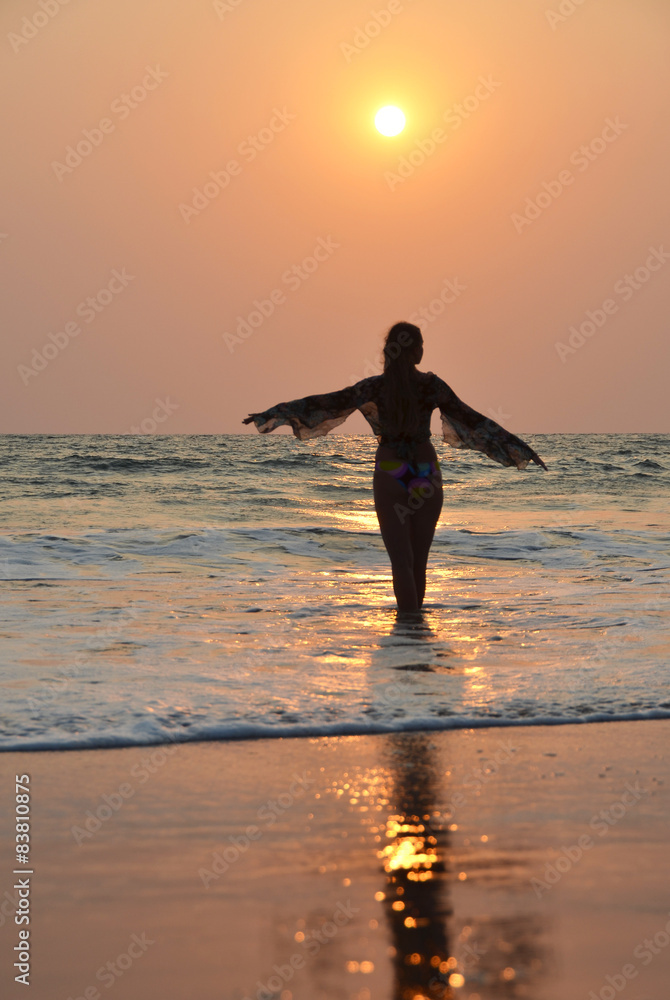 Woman on the  beach. South Goa, India