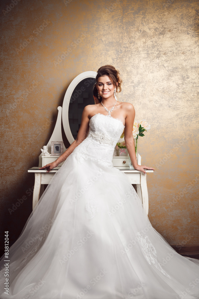 Beautiful young bride near mirror Beautiful young bride near mirror