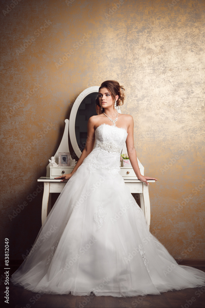 Beautiful young bride near mirror Beautiful young bride near mirror