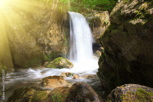 Fototapeta Naklejka Na Ścianę i Meble -  Beautiful small waterfall landscape in the mountains.