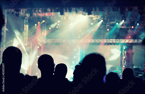Cheering crowd in front of stage lights - retro photo