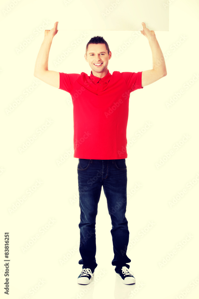Happy man showing and displaying placard Happy man showing and displaying placard