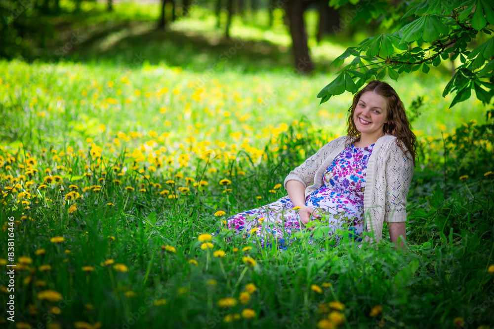 Pregnant woman in spring garden Pregnant woman in spring garden