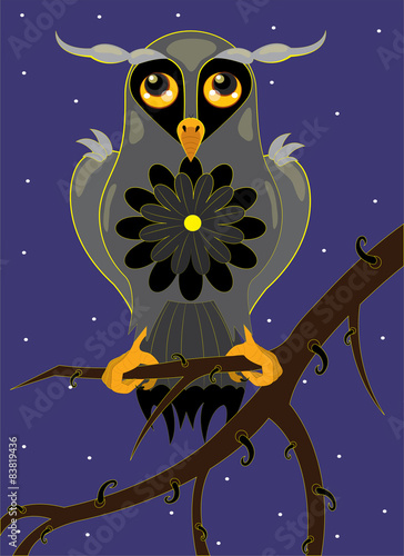 Owl on a tree branch.
