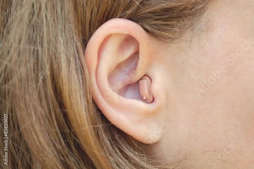 a woman with a hearing aid close-up