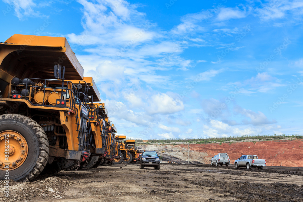 big truck in open pit and blue sky big truck in open pit and blue sky
