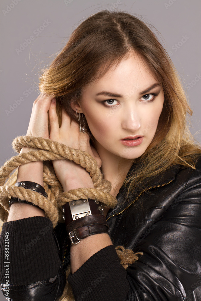 girl in a daring manner posing in the studio. girl in a daring manner posing in the studio.