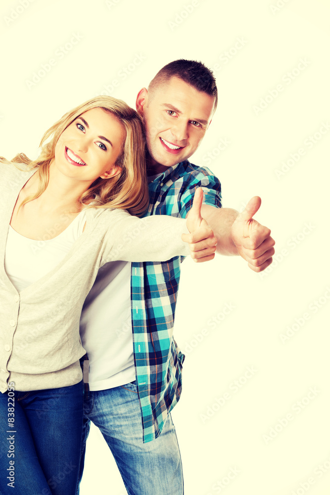 Couple showing thumbs up Couple showing thumbs up