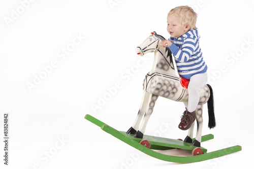 Boy and wooden rocking horse