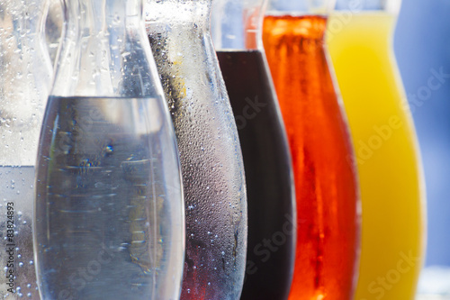 bottles of colored drinks 