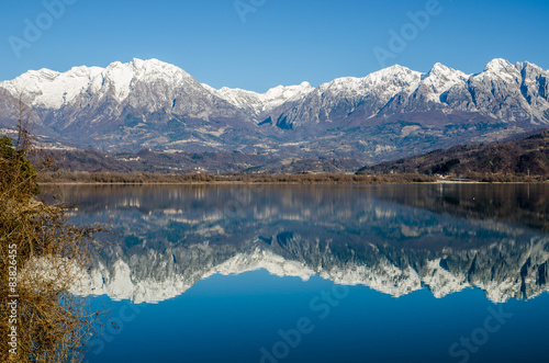 Beautiful view of a lake with mountains reflected in the water © mko61