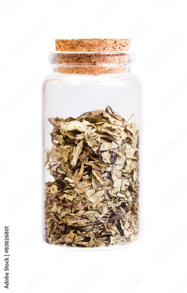 Medicinal herb in a bottle with cork stopper for medical use. Medicinal herb in a bottle with cork stopper for medical use.
