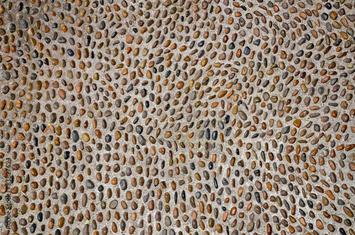 Background from multi-colored pebbles in cement  concrete 