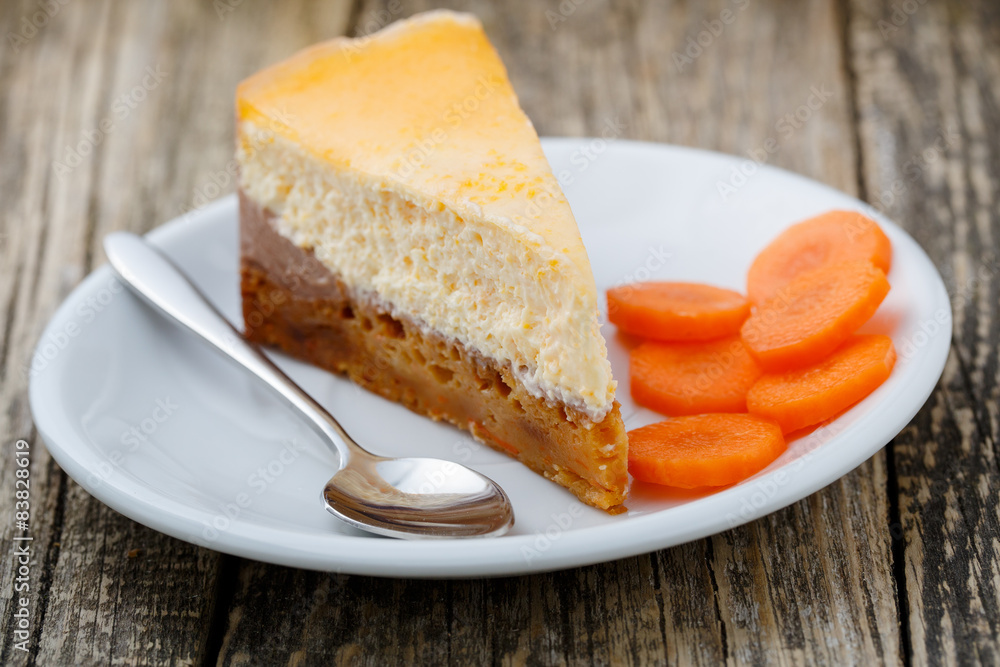 Sweet slice of carrot cake on white plate.