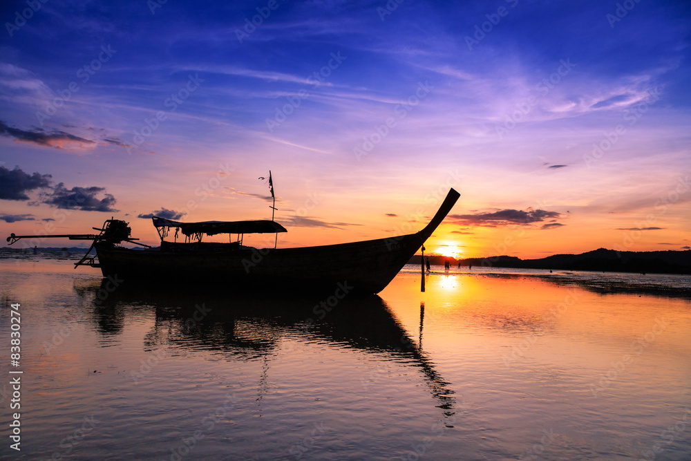 Sunset with long tail boat on Ao Nang beach Thailand Sunset with long tail boat on Ao Nang beach Thailand