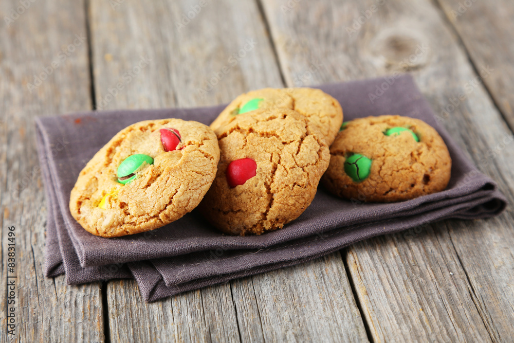Cookies with colorful candy on grey wooden background Cookies with colorful candy on grey wooden background