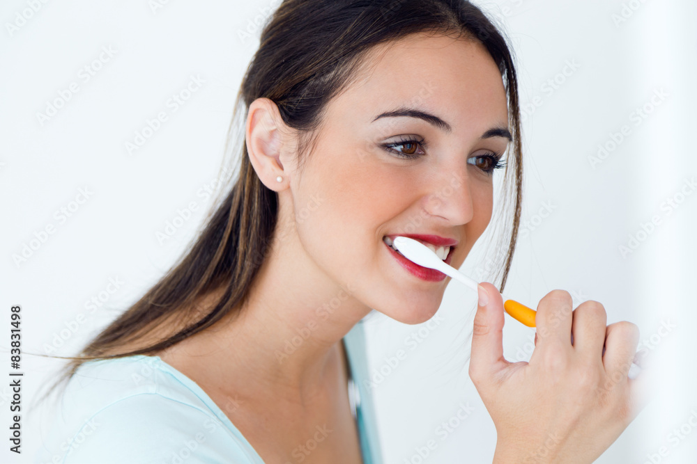 Pretty young woman brushing her teeth. Pretty young woman brushing her teeth.