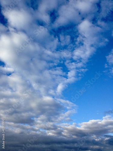 Blue sky with clouds. Nature background, dreams concept. 