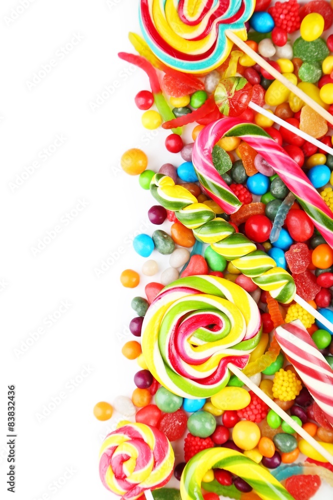 Different fruit candies on white background