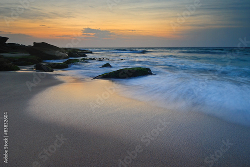 Seascape sunrise flowing waves