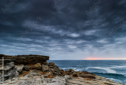 Twilight seascape with rocks