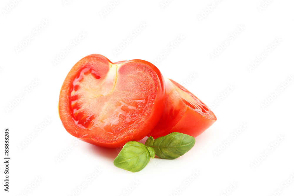 Tomatoes and basil leaves isolated on white