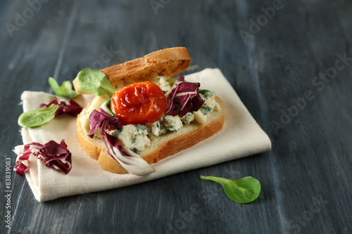 Tasty sandwich on wooden table, close up