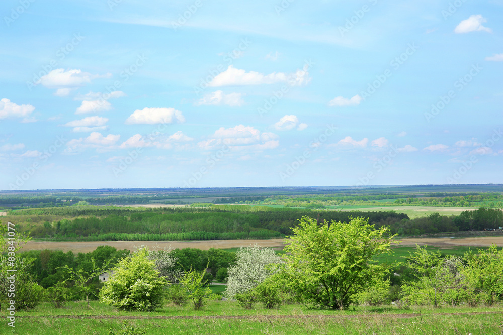 Beautiful view of countryside over blue sky background