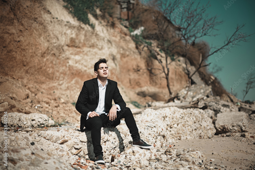 Fashion photo of the man on a seaside Fashion photo of the man on a seaside
