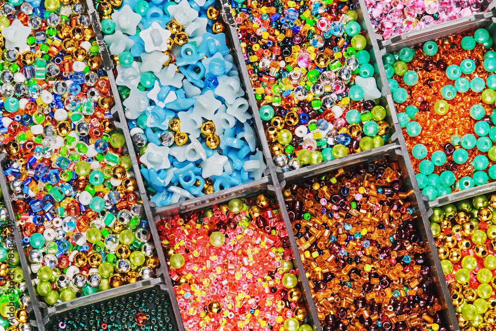 multicolored beads in a plastic box