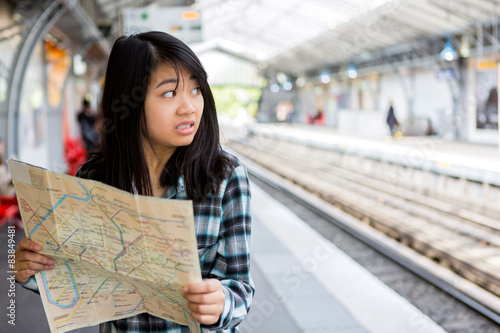 Billede på lærred Young attractive asian tourist lost in Paris