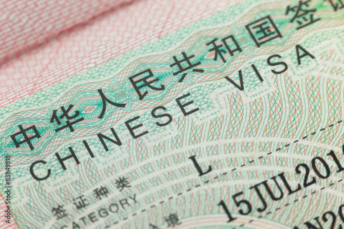 Chinese visa in a passport  page  -  enjoy travel