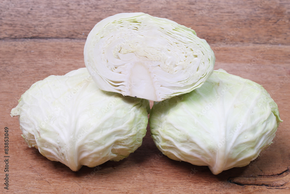 close up shot of a white collard on wood background. close up shot of a white collard on wood background.