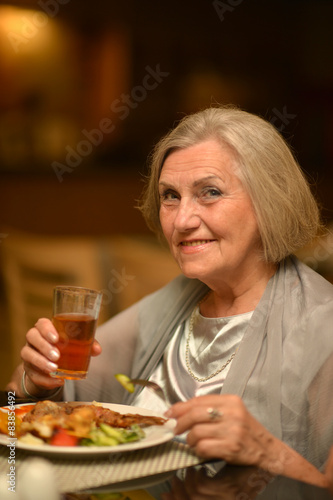 Senior woman having a dinner