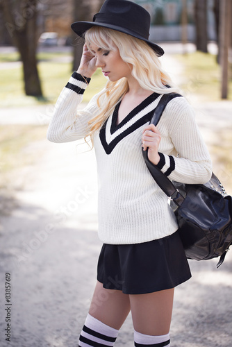 Portrait of blonde young woman outdoors