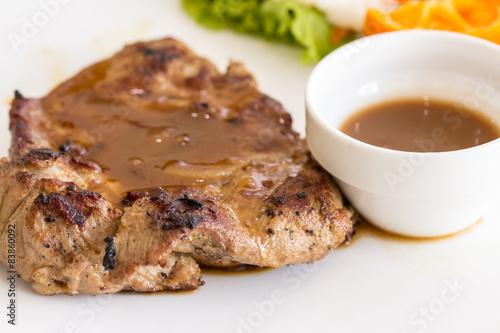 Close up of pork steak on a white plate